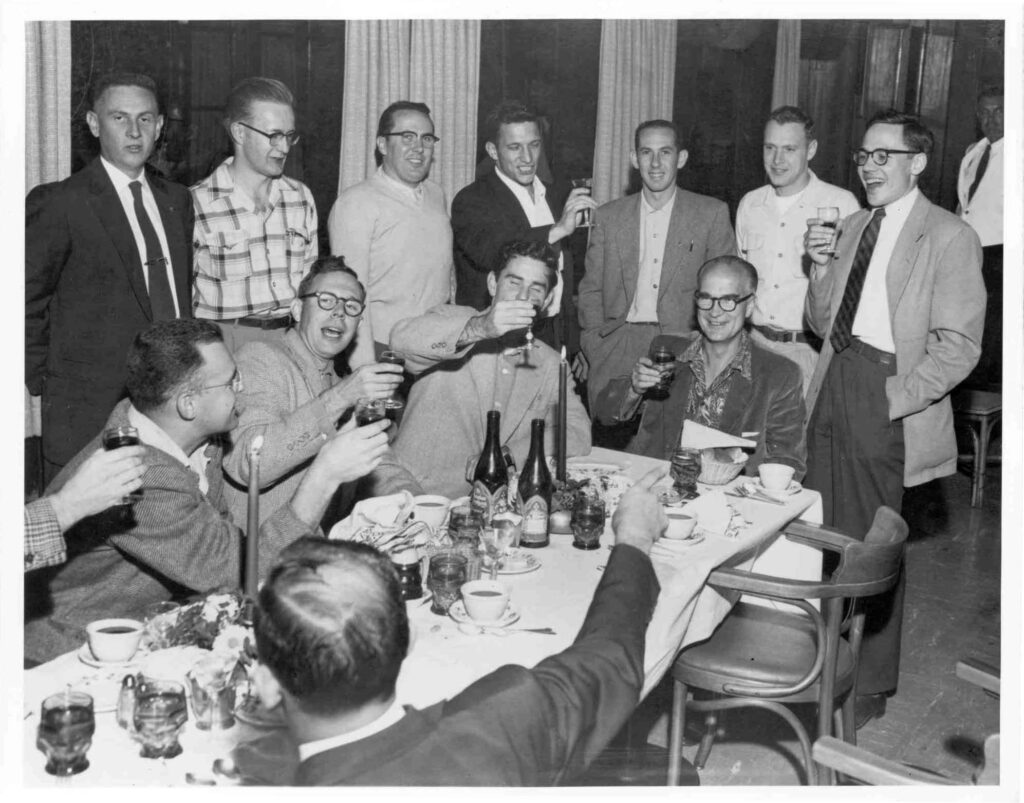 The staff of Shockley Semiconductor salute William Shockley at a champagne brunch in honor of his Nobel Prize.